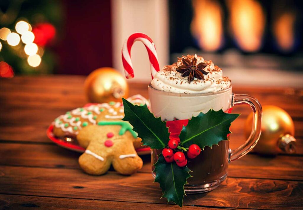 Hot chocolate in front of the fireplace served for Christmas Eve